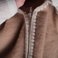 Geborduurde Merino wollen slaapzak newborn