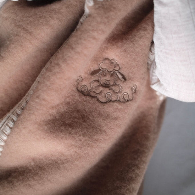 Geborduurde Merino wollen slaapzak newborn