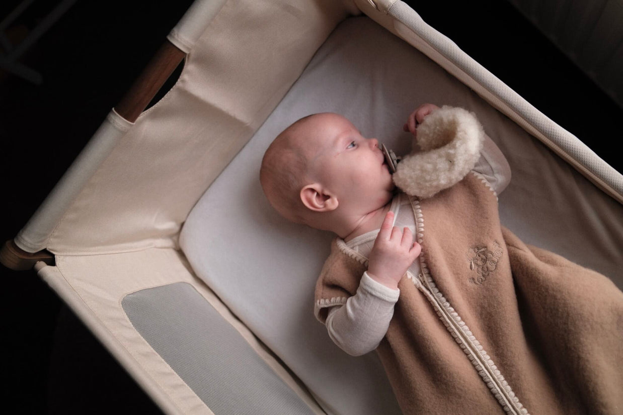 Geborduurde Merino wollen slaapzak newborn