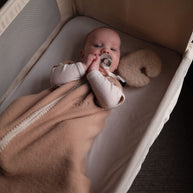Geborduurde Merino wollen slaapzak newborn