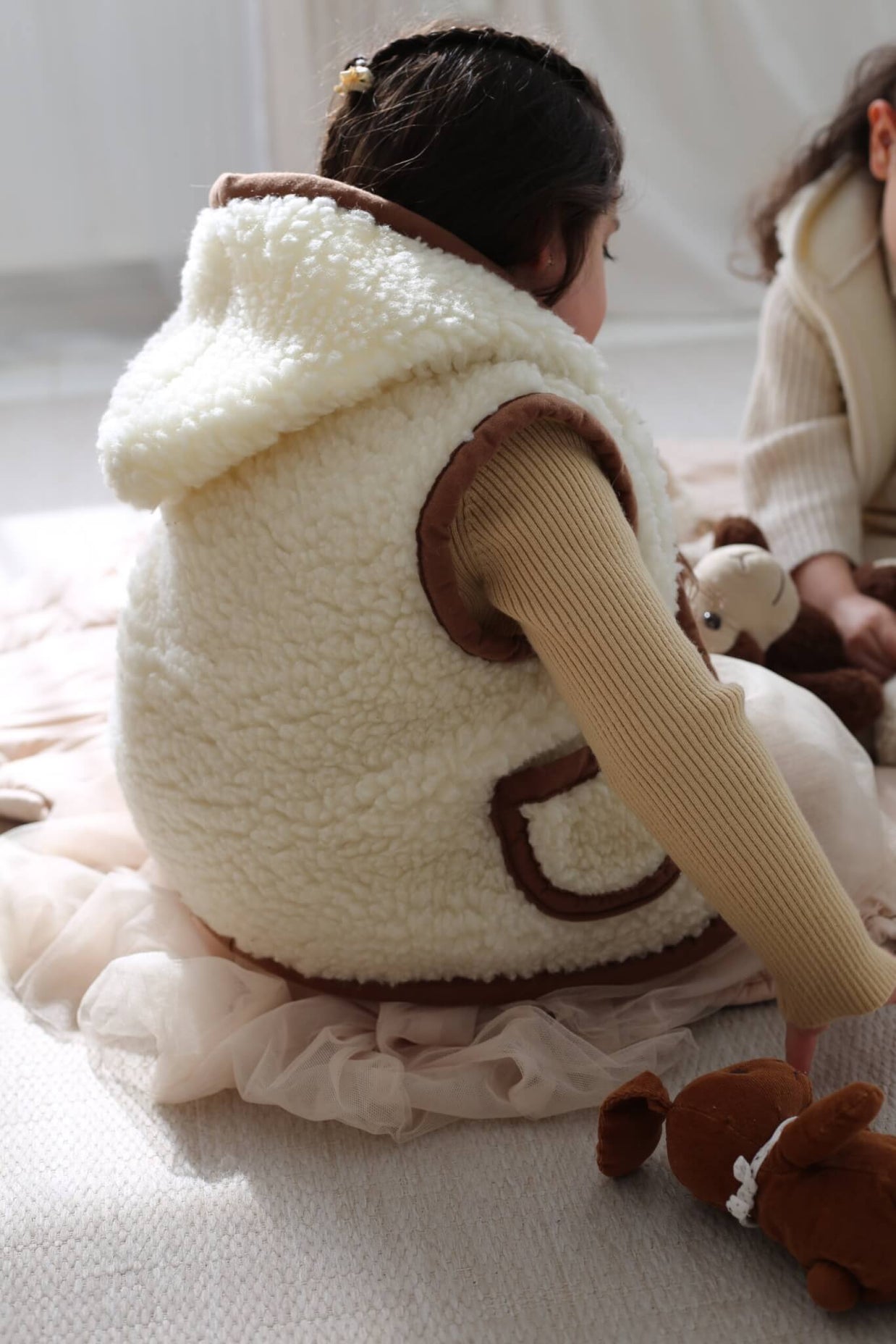 Merino wollen bodywarmer met capuchon kind - Beige met bruine rand