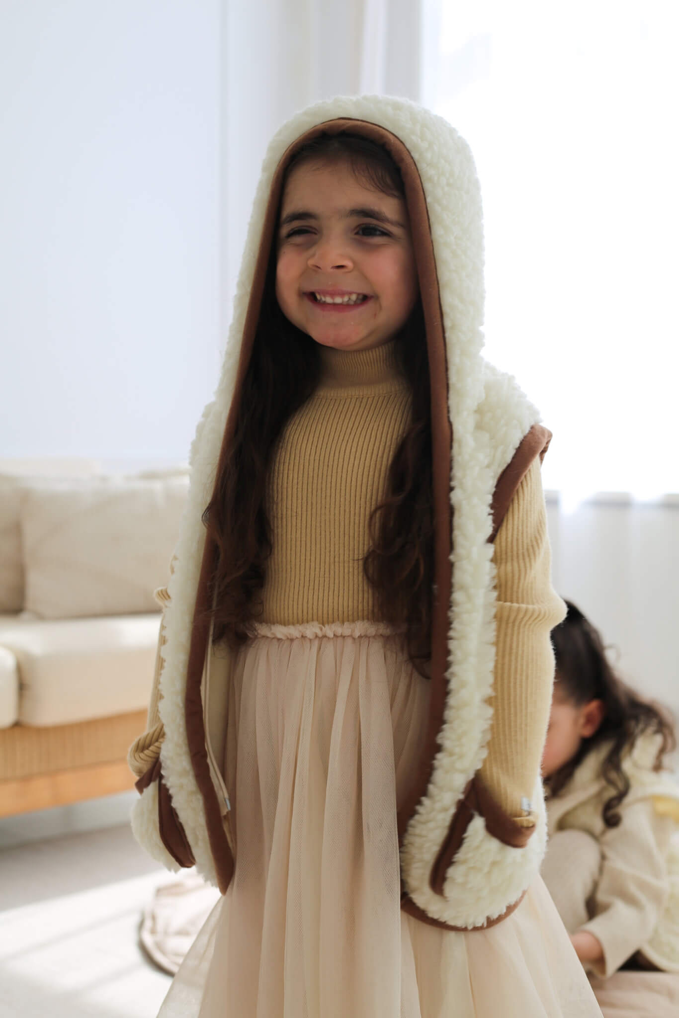 Merino wollen bodywarmer met capuchon kind - Beige met bruine rand