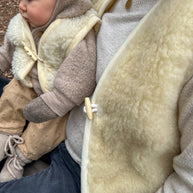 Merino wollen bodywarmer volwassenen met houten touwtjes