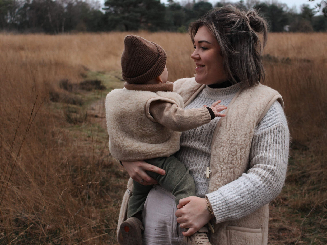 Merino wollen bodywarmer volwassenen met houten touwtjes