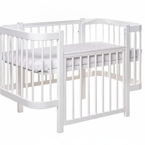 Wit ELIN babybed met afneembaar zijpaneel, omgebouwd tot bijzetbed