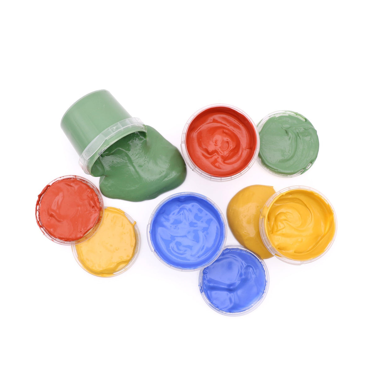 Open potjes biologische vingerverf in groen, rood, blauw en geel van bovenaf