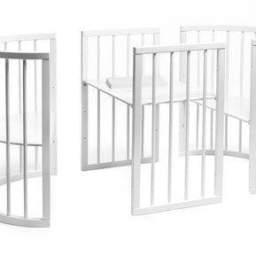 Losse onderdelen van het ronde babybed OLIN klaar voor montage
