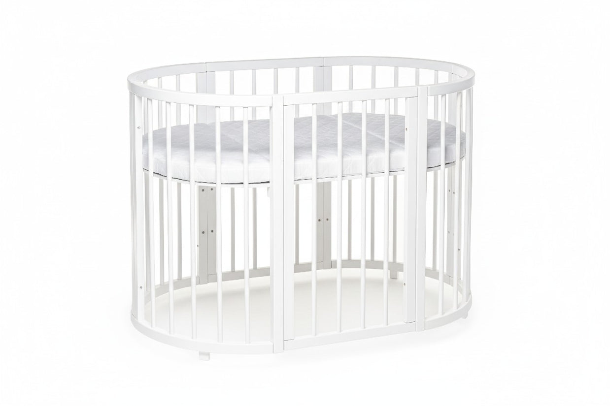 Wit ovaal babybed OLIN met matras op standaardhoogte