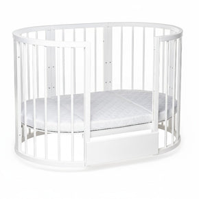 Wit ovaal babybed OLIN met matras in lage peuterbed-opstelling