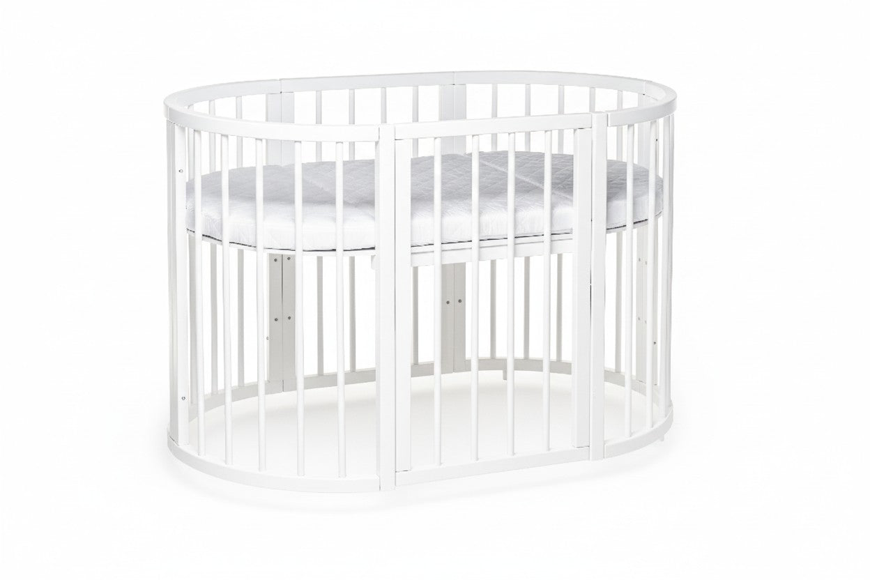 Ovaal babybed OLIN met matras en een verlaagde instapzijde